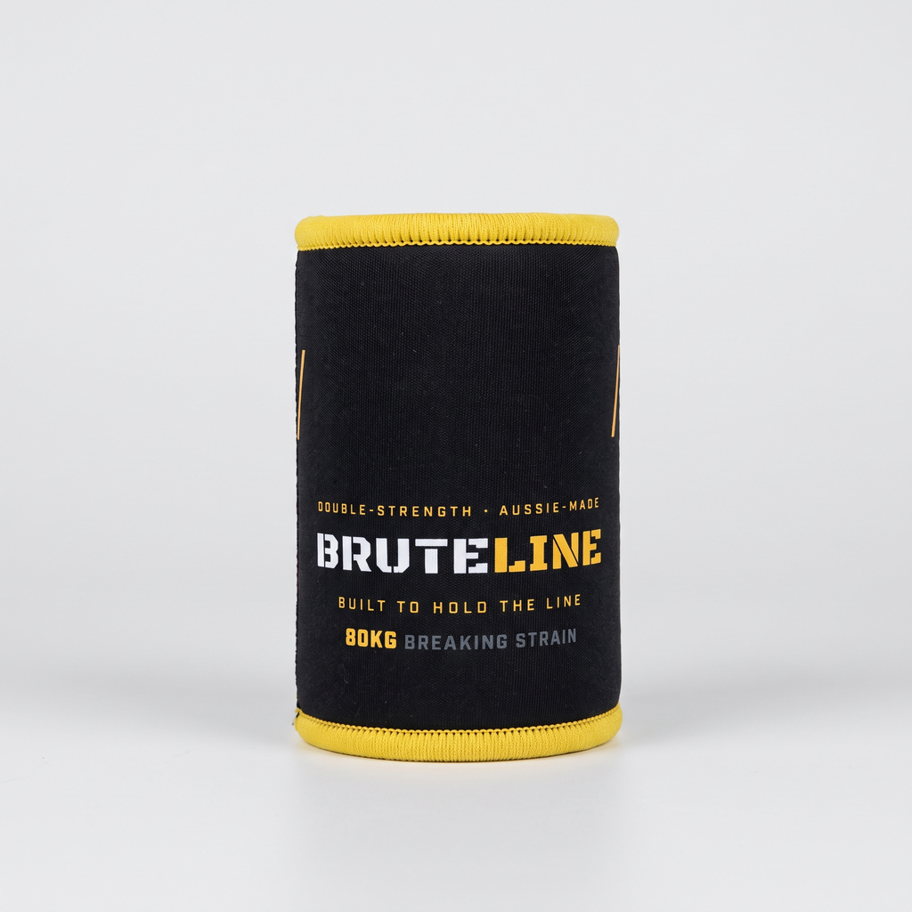 Empty BruteLine stubbie cooler showing the printed branding and yellow stitched binding